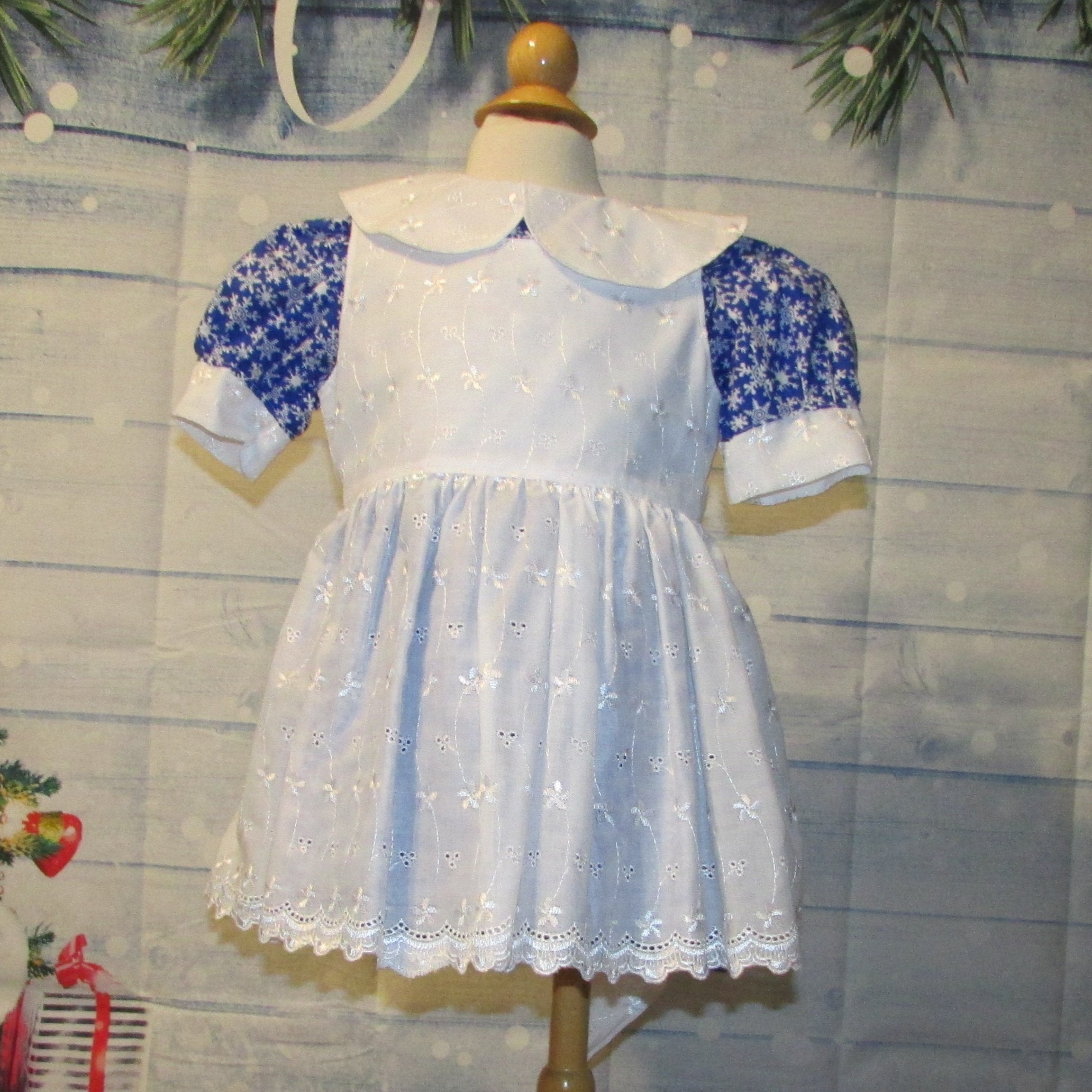 2 Pc. Blue Snowflake Christmas Dress with White Eyelet Overlay Tadpole Apparel 2 Pc. Blue Snowflake Christmas Dress with White Eyelet Overlay Tadpole Apparel