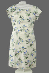 Floral dress on a mannequin against a white backdrop